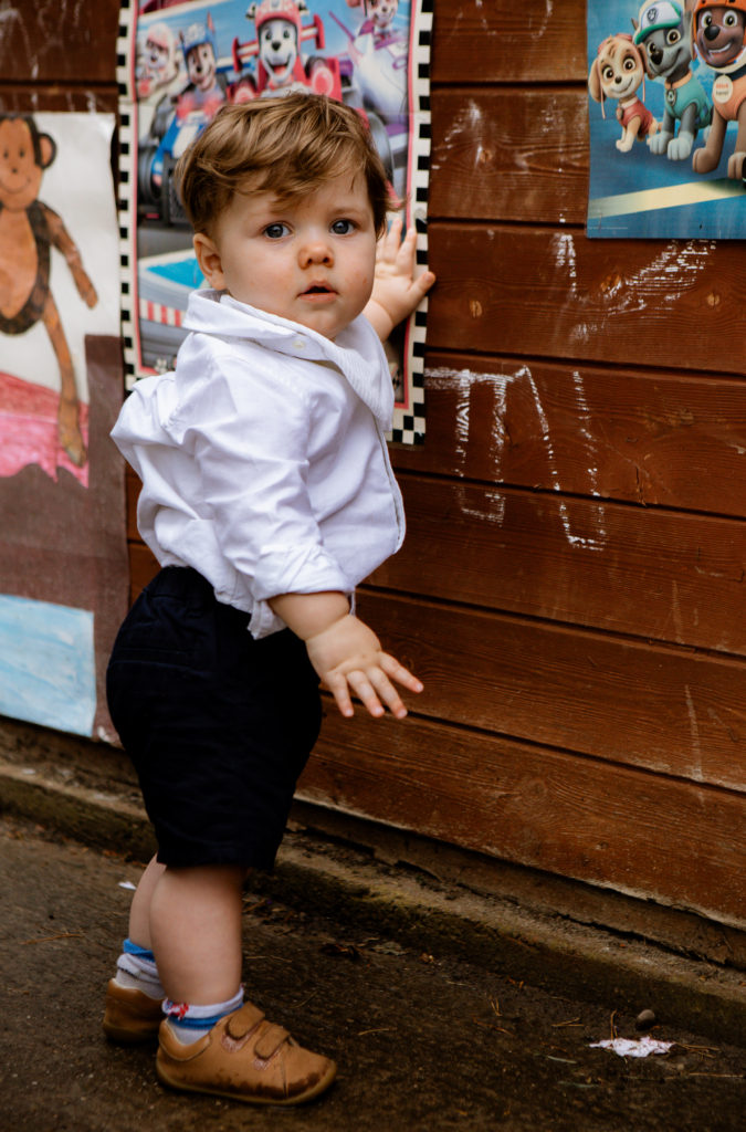 page boy, against wall