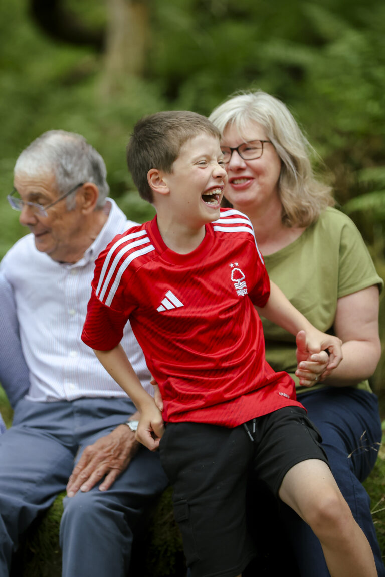 Parents and children laughing during relaxed Derbyshire family shoot