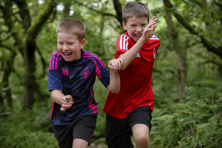 boys brothers running and laughing in family shoot