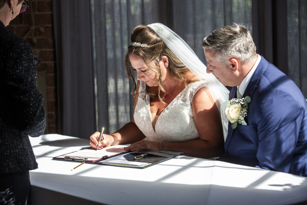 Shadow and wonderful light while couple sign register
