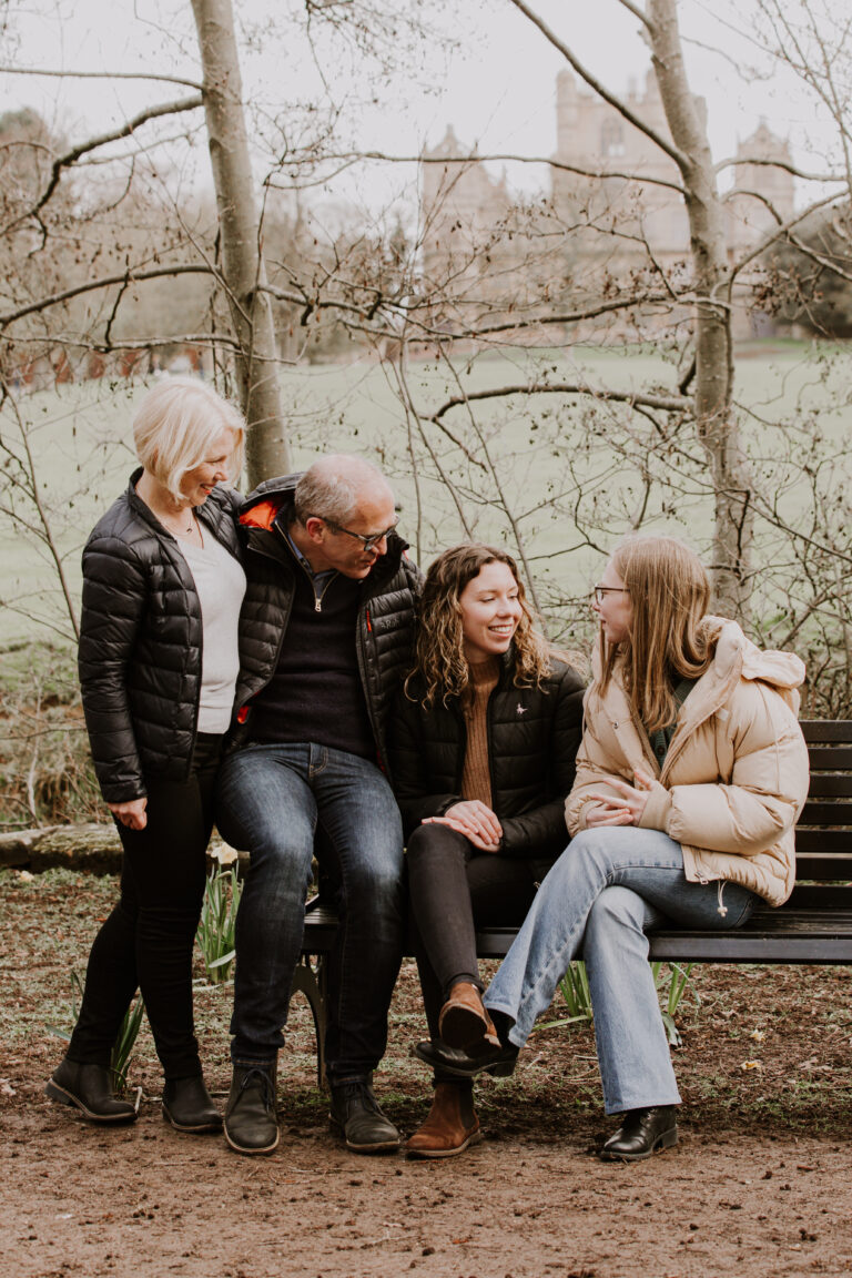 teenage family with parents in park