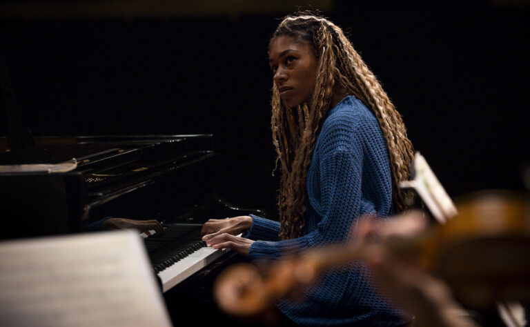 Kanneh-Mason playing piano at Theatre Royal Nottingham during rehearsal with Sinfonia Viva