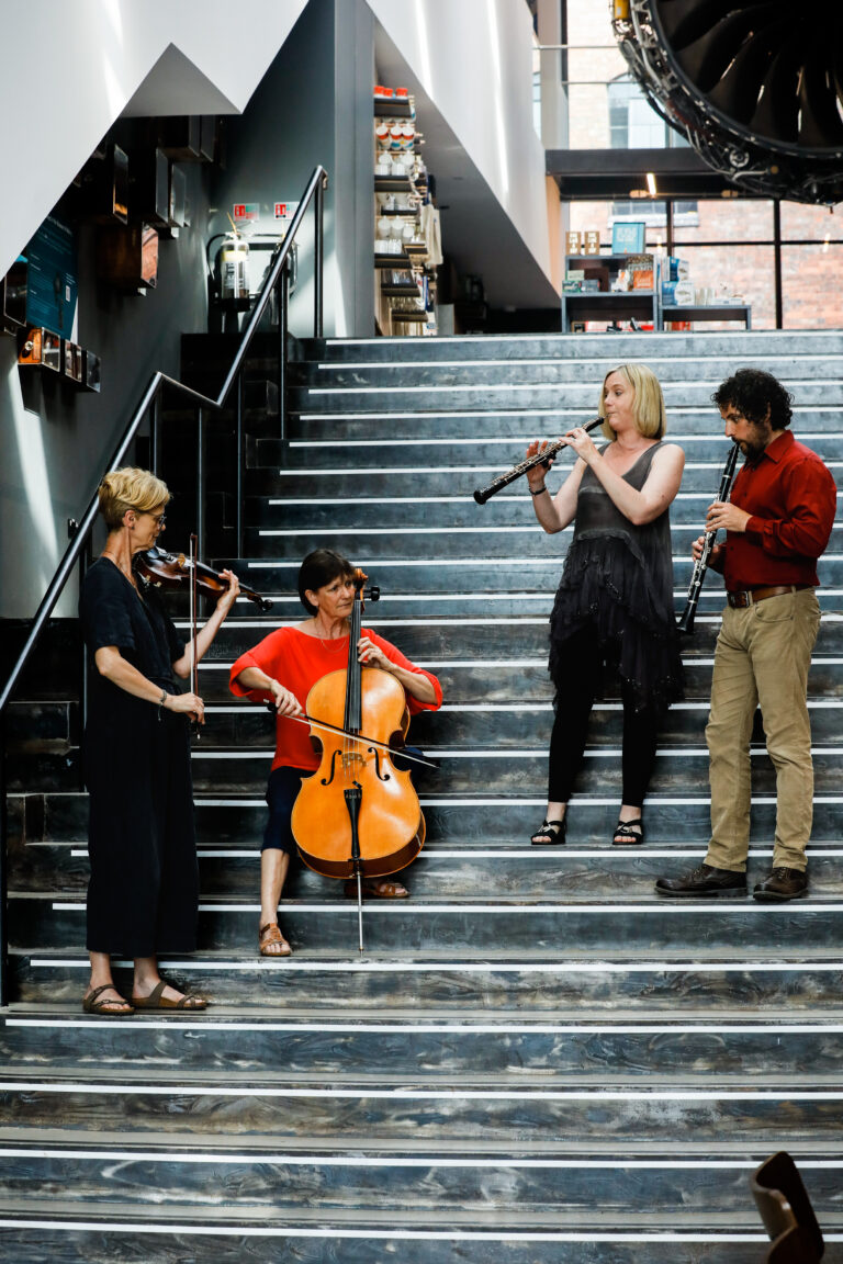 Sinfonia Viva players at museum of making in Derby on stairs