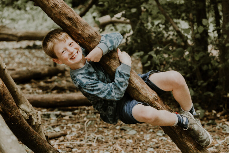 boy hugging tree on East Midlands photoshoot