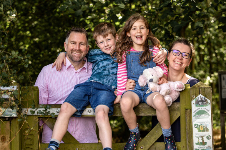 Parents and children laughing during relaxed East Midlands family shoot