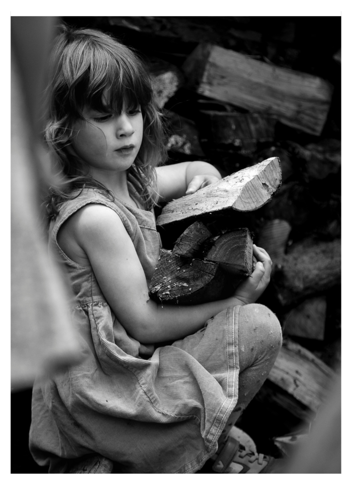 Family photoshoot - Girl carrying logs