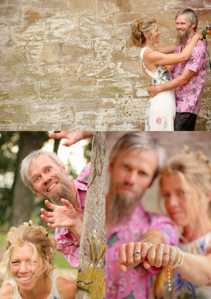 Bride and groom embracing and smiling against a sandstone wall, natural wedding photography by Ali J, Nottingham